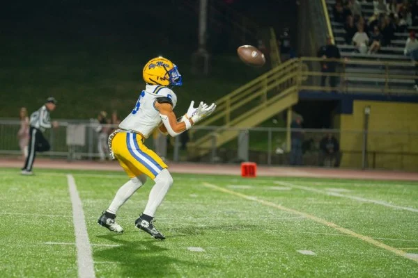 wide receiver catching football